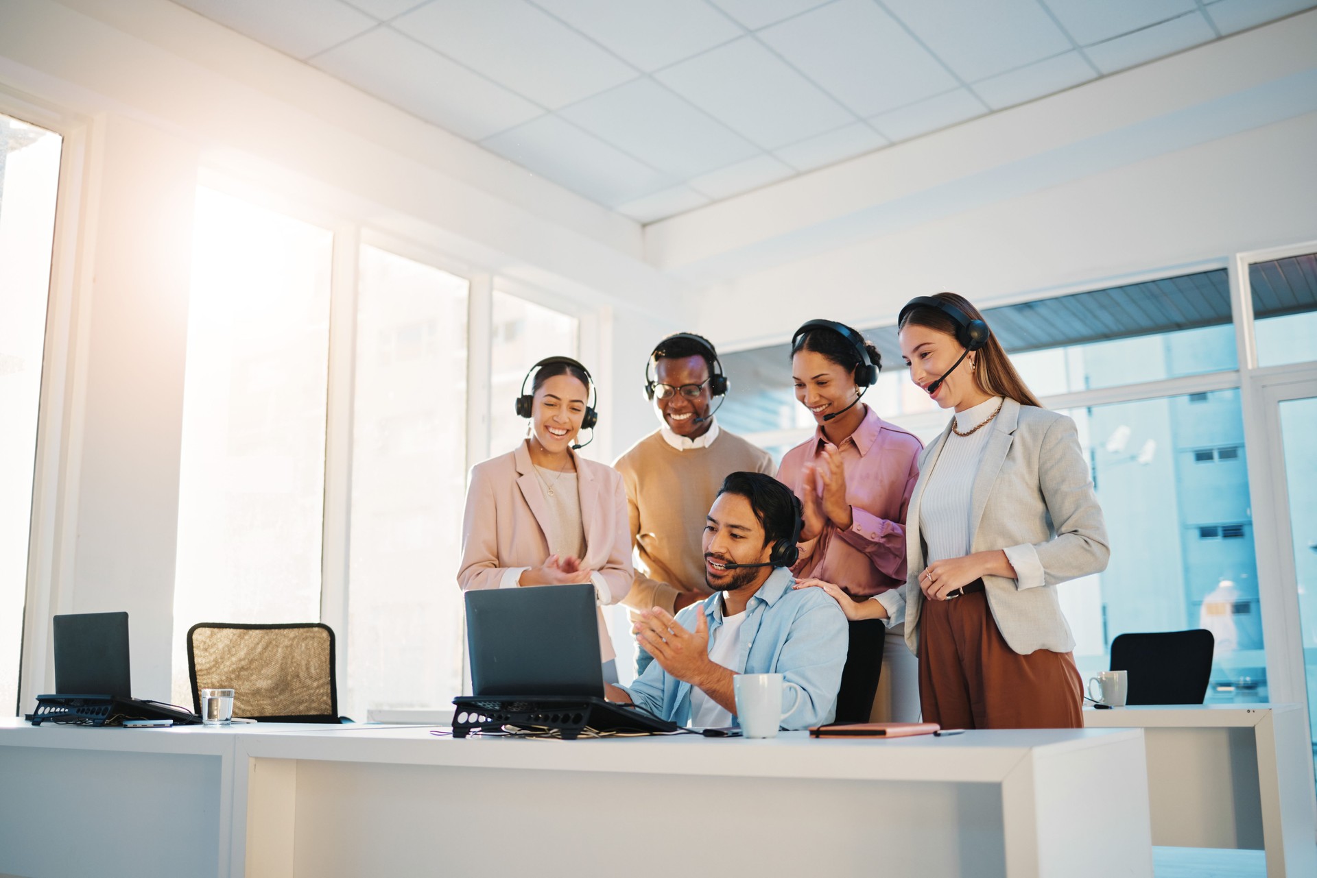 Call center, teamwork or happy with sale for support, collaboration and customer service in office. Telemarketing, men and women or employee with excited face for communication and learning at work